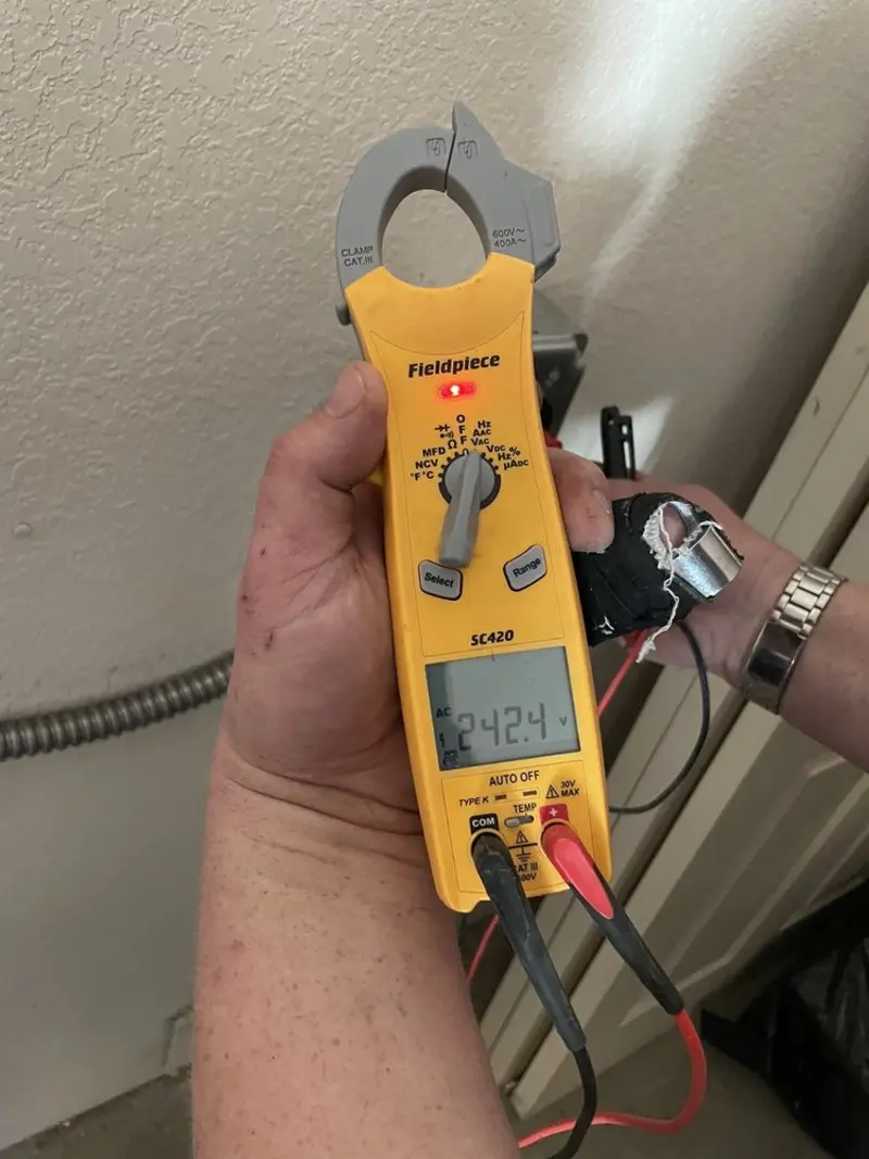 Voltage testing with clamp meter during Whole House Surge Protector in Powder Springs